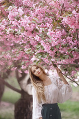 Woman at Blossoming Sakura Tree on Nature
