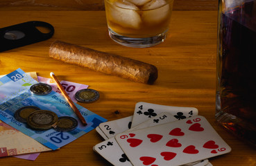 Tobacco Cigar , playing cards, Scotch whiskey and mexico banknotes