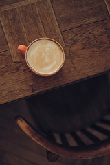 Cup of cappuccino on wooden table in cafe - 329300114