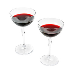 Two glasses with red wine isolated on a white background.