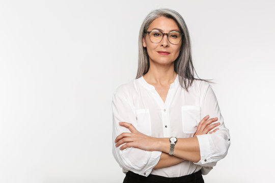 Image of adult mature woman wearing eyeglasses and office clothes