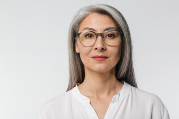 Fototapeta premium Image of adult mature woman wearing eyeglasses and office clothes