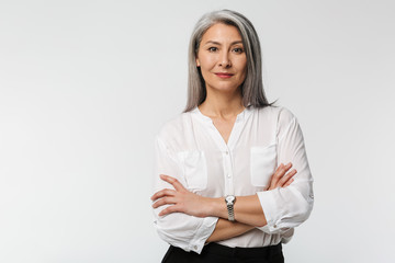 Image of adult mature woman with long gray hair wearing office clothes