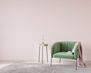 Soft green armchair on a pink wall background