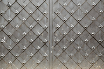 Old vintage metal panel with decorative ornamental cellular pattern frame square background