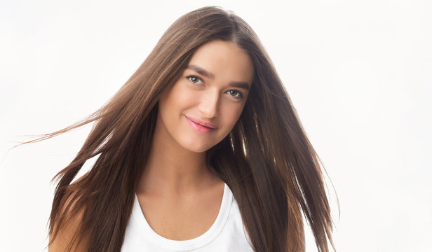 Young woman with long flying healthy hair