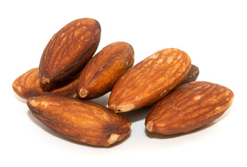 pile of almonds seeds isolated on white background