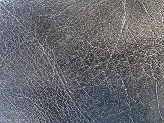 Fototapeta na wymiar Texture of bike seat. black colour leather background.