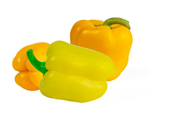 three yellow juicy sweet peppers close-up isolated on a white background