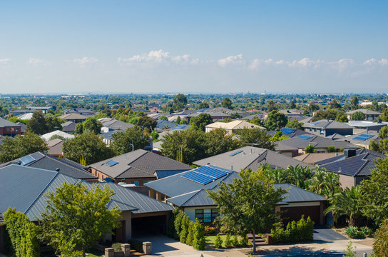 Aerial View Of Residential Houses In Melbourne's Suburb. Elevated View Of Australian Homes Against Blue Sky. Copy Space For Text. Point Cook, VIC Australia.