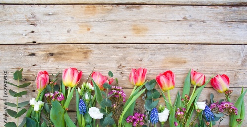 colorful tulips on wooden background