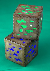 Fototapeta premium Minecraft cubes made of plastic. Two brown minecraft cubes with glowing Windows