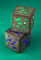 Naklejka premium Minecraft cubes made of plastic. Two brown minecraft cubes with glowing Windows