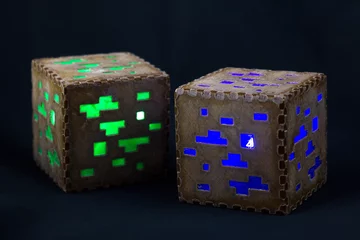 Fotobehang Minecraft cubes made of plastic. Two brown minecraft cubes with glowing Windows © SVETLANA