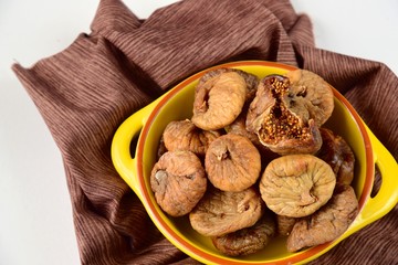 Dried figs in a yellow bowl