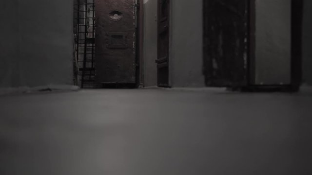 Dark prison corridor, old walls, scary