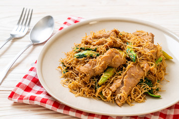 Stir fried rice vermicelli noodle with black soy sauce and pork