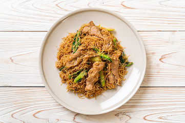 Stir fried rice vermicelli noodle with black soy sauce and pork