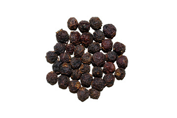 Hawthorn pile isolated on white background. Fresh dried white haw heap for medical use. Top view. Fruit of Crataegus, thornapple, may-tree, whitethorn, or haw berry. 