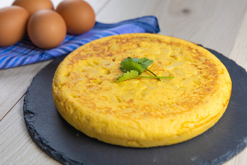 Spanish potato omelette dish with egg ready to eat