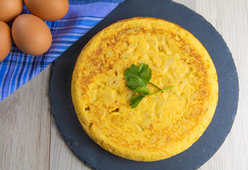 Spanish potato omelette dish with egg ready to eat