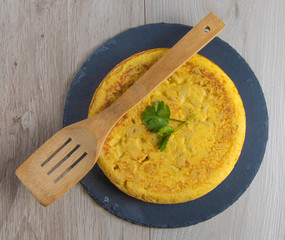 Spanish potato omelette dish with egg ready to eat