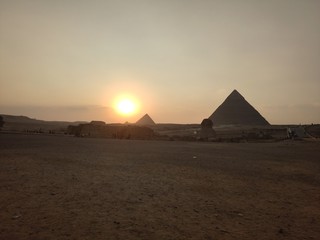 Fototapeta na wymiar sunset over the pyramids in egypt