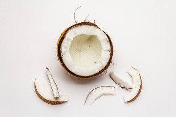 Ripe coconut cut on two half isolated on white background