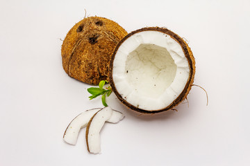 Ripe coconut cut on two half isolated on white background