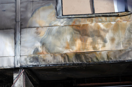 The consequences of a fire in a supermarket (part 2 of 3). A detailed shot of Burnt walls and windows of a grocery store. The criminal scene of the investigation of the crime. Intentionally set fire. 