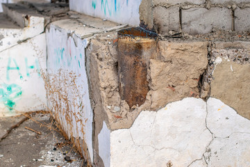 cracks and chips on the ruined foundation of the old building structure
