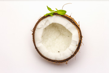 Ripe coconut cut on two half isolated on white background