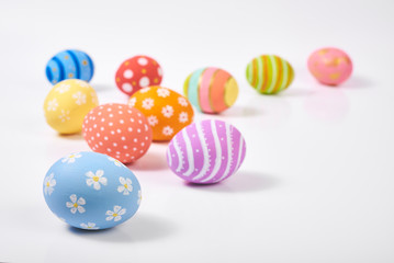 Top View. Creative layout  Easter paint colorful  Eggs various pattern handmade on isolated white...