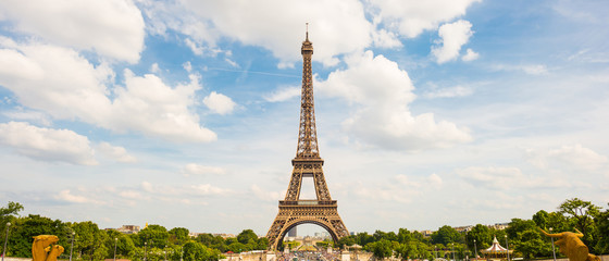 The Eiffel Tower in Paris on a beautiful summer day with bright sun