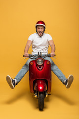 happy delivery man in helmet riding scooter on yellow background