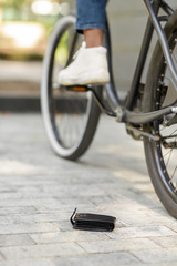 Naklejka premium Daylife Troubles. Man Lost His Wallet While Riding Bike Outdoors