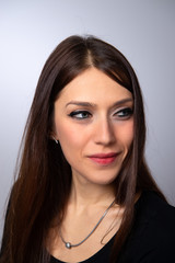 Naklejka premium A lady with everyday jewelry for a chic look and trendy makeup with cosmetics