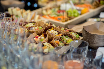 a lot of food on the buffet table in the restaurant