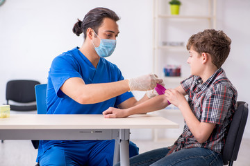 Young boy visiting doctor in hospital