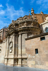 Fototapeta premium The beautiful cathedral of Saint Mary in the Spanish city of Murcia. Ornate carvings decorate the rooftops of this monument.
