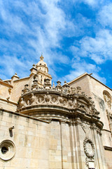 Fototapeta premium The beautiful cathedral of Saint Mary in the Spanish city of Murcia. Elaborate carvings adorning the roof of this grand building.