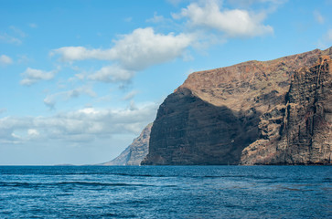 Fototapeta na wymiar Huge majestic cliffs of Los Gigantes. Only the sea and the rocks.