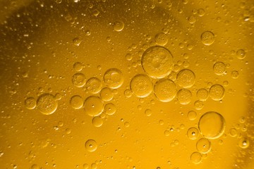 Biodiesel, bubbles biofuel, vegetable oil, yellow and orange emulsion bubbles background.