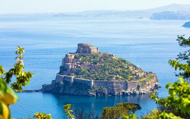 Aerial view of Aragonese Castle, most popular landmark and travel destination located in Tyrrhenian sea near Ischia island, Italy. - obrazy, fototapety, plakaty