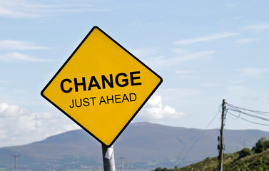 Yellow road sign with the words 