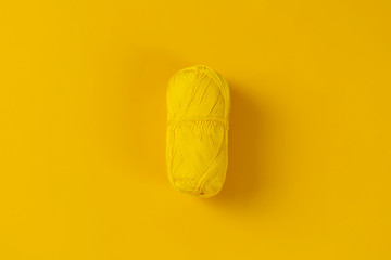 a top view of the isolated single one yarn roll for knitting homemade craft on the colorful background