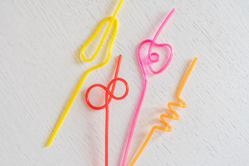 set of some trendy spinned and rolled drinking straws flat lay, unusual creative party concept