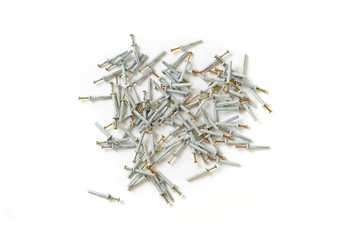 view from above of the bunch of metal steel screws or dowels with plastic caps isolated on table