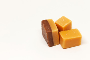 chocolate pieces with salt on white background