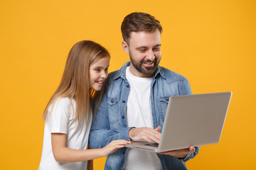Smiling bearded man in casual clothes have fun with child baby girl. Father little kid daughter...